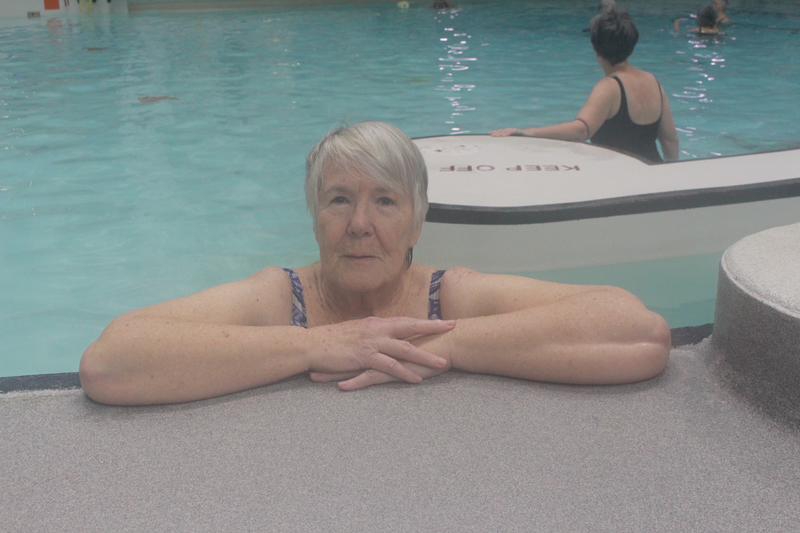 Swimmer at edge of pool